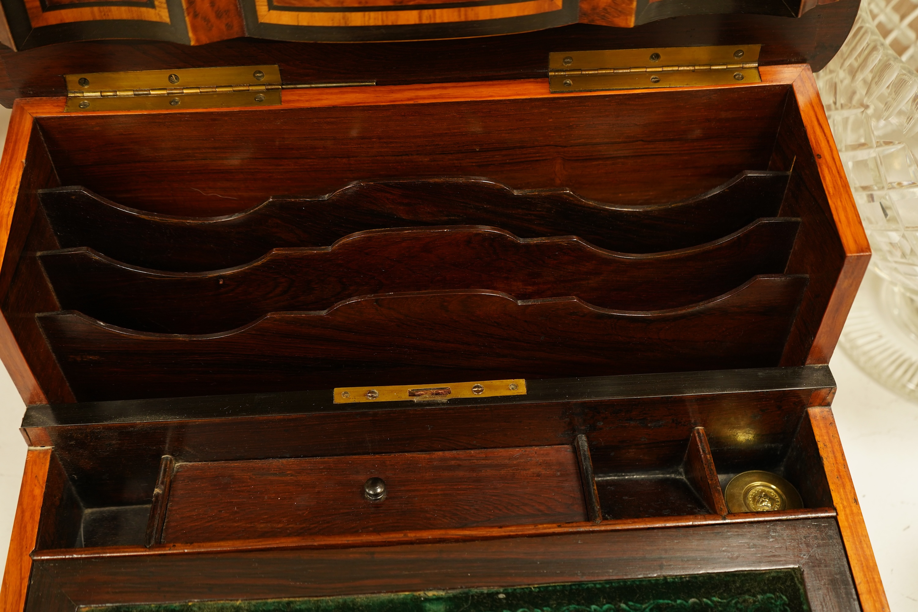 A 19th century French brass inlaid, tulip banded amboyna writing casket, the brass panel inscribed ‘Jane Lester’, 40cm wide